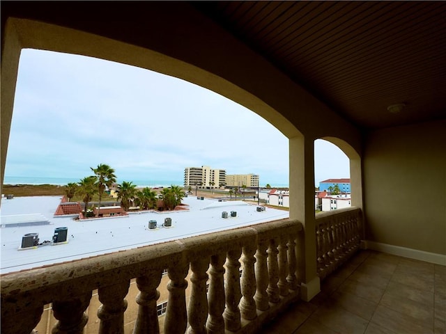 balcony featuring a water view