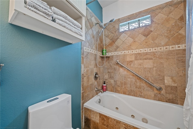 bathroom with shower / bath combo and toilet