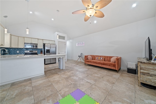 kitchen with stainless steel appliances, sink, ceiling fan, backsplash, and pendant lighting