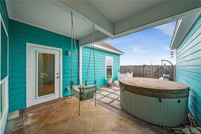 view of patio / terrace with a hot tub