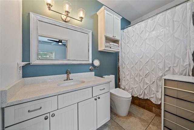 bathroom with toilet, tile patterned floors, curtained shower, vanity, and ceiling fan