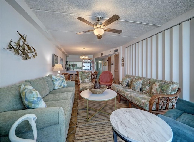 6109 State Highway 361 Unit 601, Port Aransas, TX 78373 - living room with a chandelier, a ceiling fan, and a textured ceiling