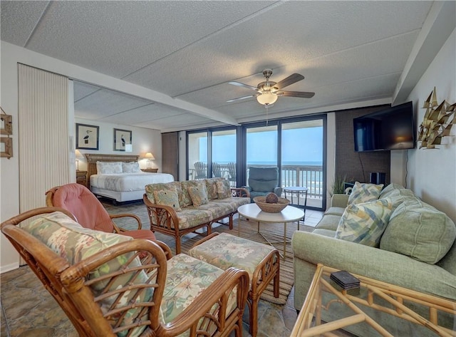 6109 State Highway 361 Unit 601, Port Aransas, TX 78373 - living area featuring ceiling fan and a textured ceiling