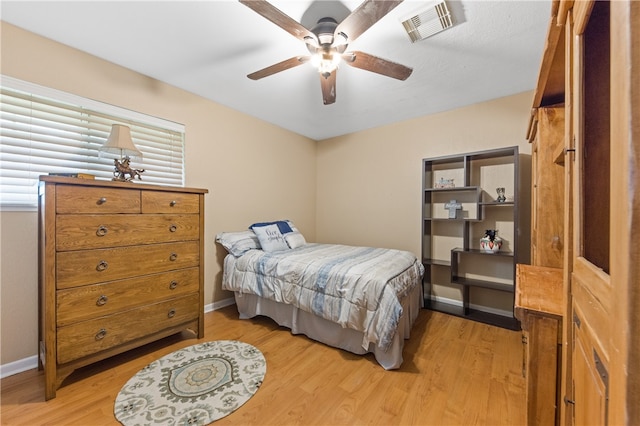 bedroom featuring ceiling fan and light wood-type flooring