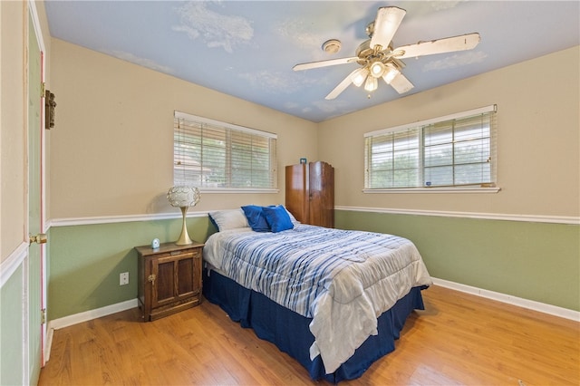 bedroom featuring ceiling fan and light hardwood / wood-style floors