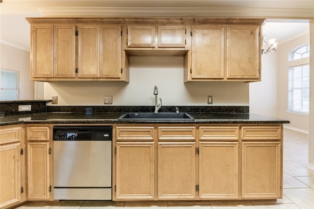 kitchen featuring dishwasher, crown molding, dark stone countertops, and sink