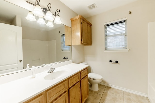 bathroom with tile patterned floors, vanity, and toilet