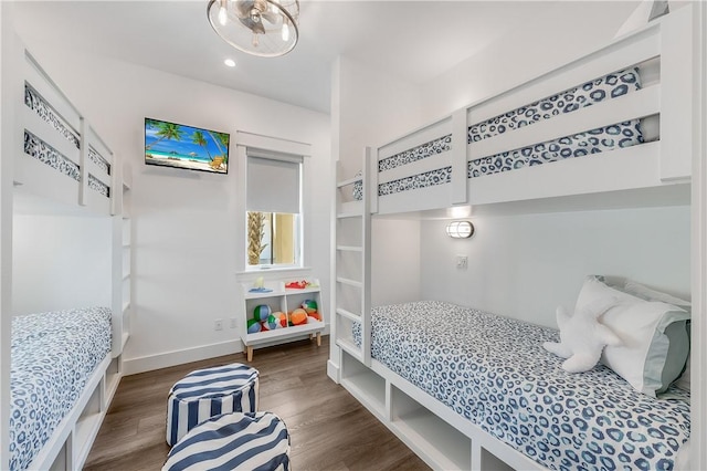 bedroom featuring wood finished floors, recessed lighting, and baseboards