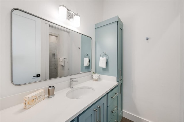 full bathroom with vanity and tiled shower