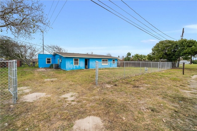 back of property featuring a lawn