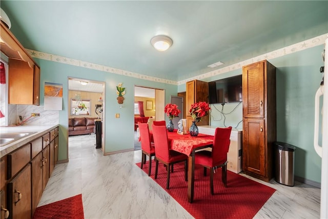 dining space with sink