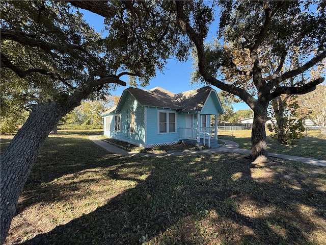 view of side of home featuring a yard