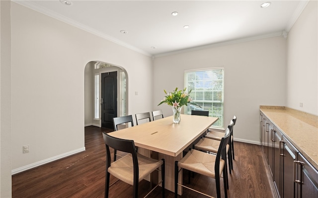 dining area with crown molding and dark wood-type flooring