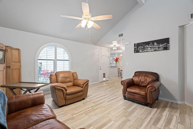 living room featuring ceiling fan, high vaulted ceiling, and light hardwood / wood-style flooring