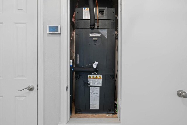 utility room featuring heating unit