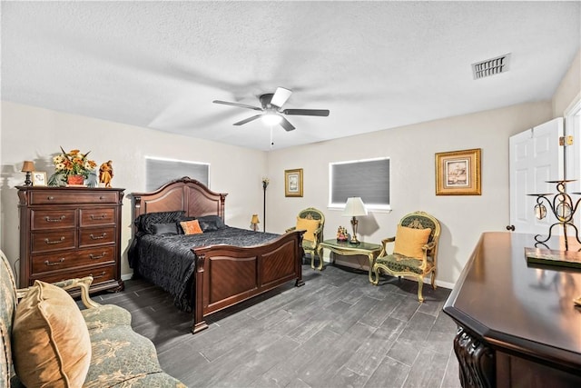 5213 Inverness Dr, Corpus Christi, TX 78413 - bedroom with dark wood-style floors, ceiling fan, and a textured ceiling