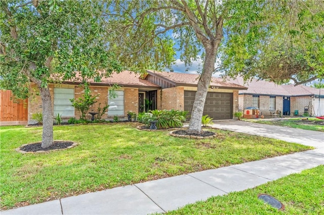 5213 Inverness Dr, Corpus Christi, TX 78413 - view of front facade with brick siding, a garage, driveway, and a front yard