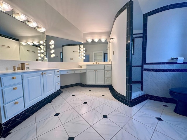 full bathroom with tile patterned floors, walk in shower, and vanity