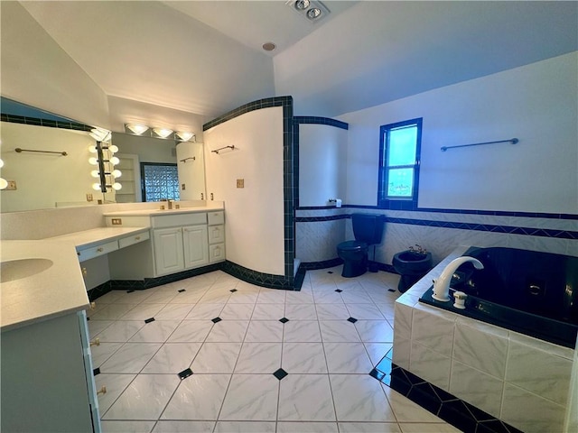 bathroom with a whirlpool tub, tile patterned flooring, a sink, and two vanities