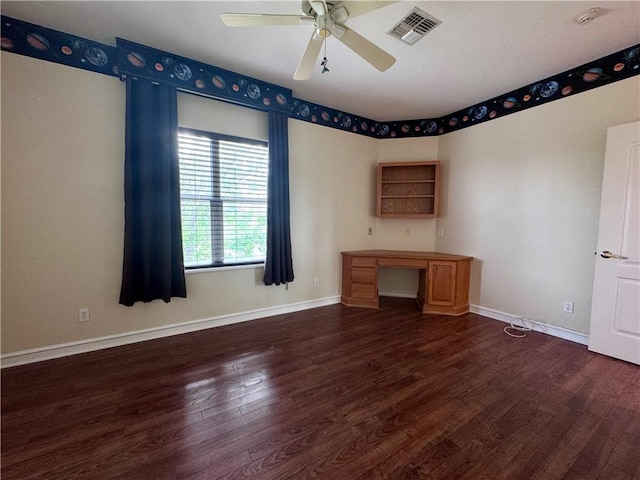 interior space with dark wood-style floors, a ceiling fan, visible vents, and baseboards