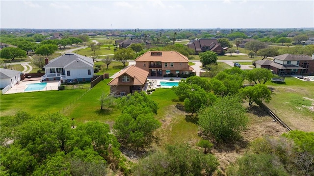 birds eye view of property with a residential view