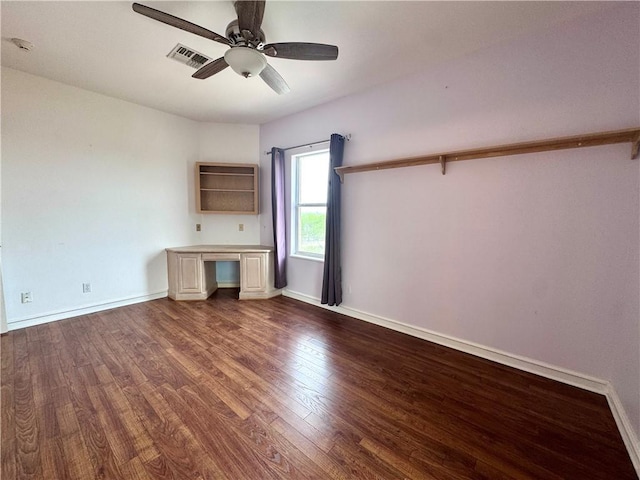 interior space with dark wood finished floors, visible vents, a ceiling fan, and baseboards
