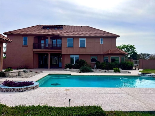 view of pool featuring a patio area and a pool with connected hot tub