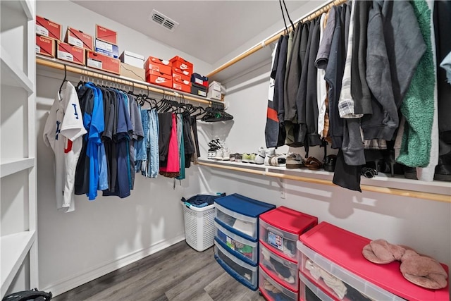 702 W 1st St, Bishop, TX 78343 - walk in closet featuring visible vents and wood finished floors