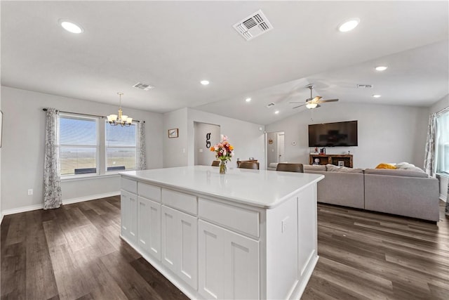 702 W 1st St, Bishop, TX 78343 - kitchen with white cabinets, dark wood-type flooring, a healthy amount of sunlight, and visible vents