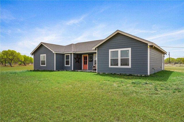 702 W 1st St, Bishop, TX 78343 - ranch-style house featuring a front lawn