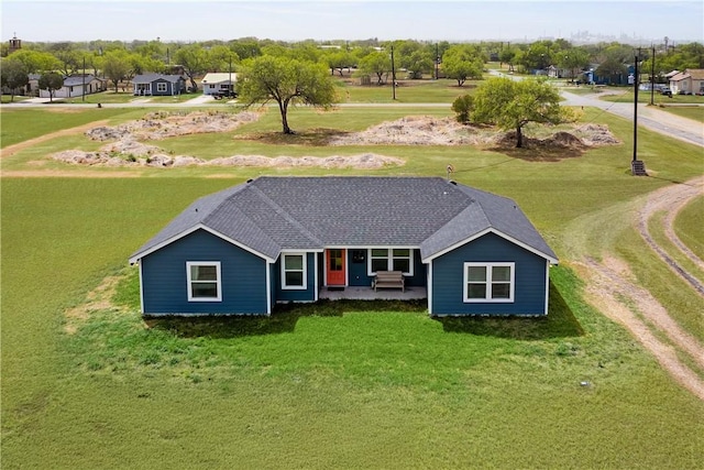 702 W 1st St, Bishop, TX 78343 - view of front of home with roof with shingles and a front yard