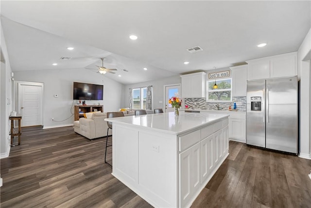 702 W 1st St, Bishop, TX 78343 - kitchen with ceiling fan, dark wood finished floors, plenty of natural light, and stainless steel refrigerator with ice dispenser