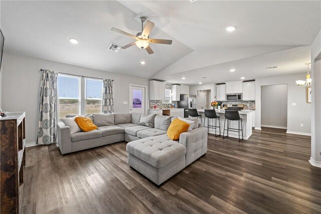 702 W 1st St, Bishop, TX 78343 - living area featuring a ceiling fan, dark wood-type flooring, lofted ceiling, and visible vents