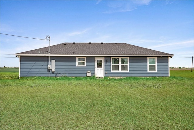 702 W 1st St, Bishop, TX 78343 - back of property featuring a yard and roof with shingles