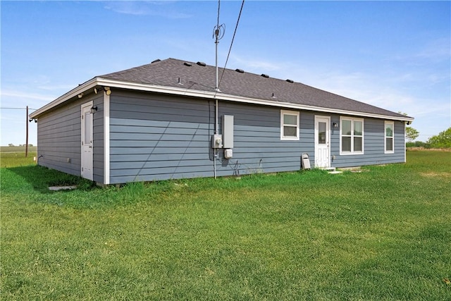 702 W 1st St, Bishop, TX 78343 - rear view of property with a lawn