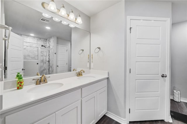 702 W 1st St, Bishop, TX 78343 - full bathroom with a sink, visible vents, and baseboards