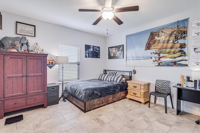 bedroom featuring baseboards and a ceiling fan