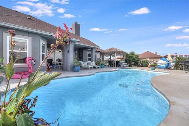 view of swimming pool with a fenced in pool and a patio area