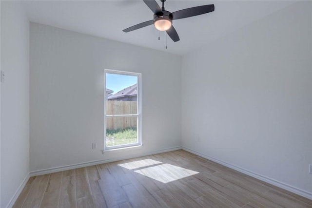 spare room featuring ceiling fan and light wood-type flooring