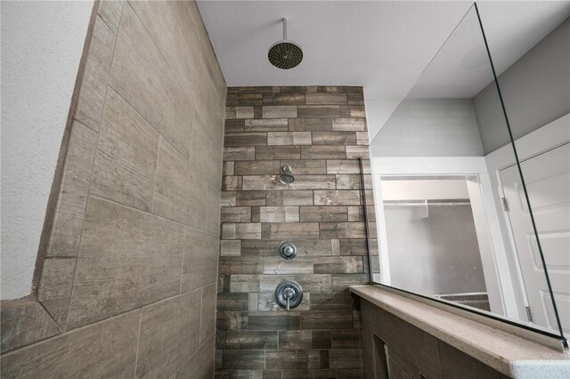 bathroom with a tile shower