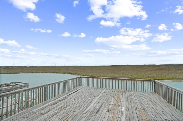 wooden terrace with a water view