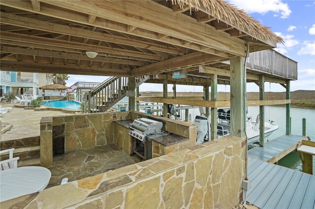 view of dock with a water view