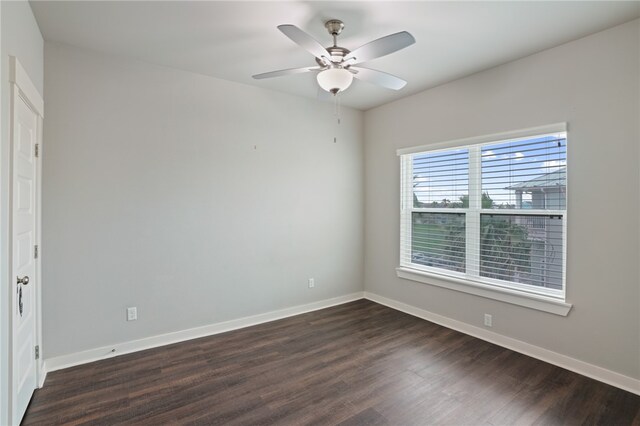 unfurnished room featuring dark hardwood / wood-style flooring and ceiling fan