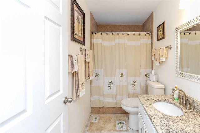 bathroom featuring vanity, tile patterned flooring, a shower with shower curtain, and toilet