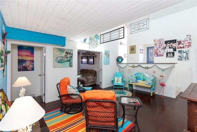 living area with wood finished floors and wood ceiling