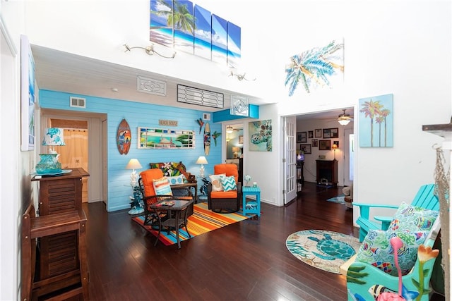 interior space featuring wood finished floors, ceiling fan, and visible vents