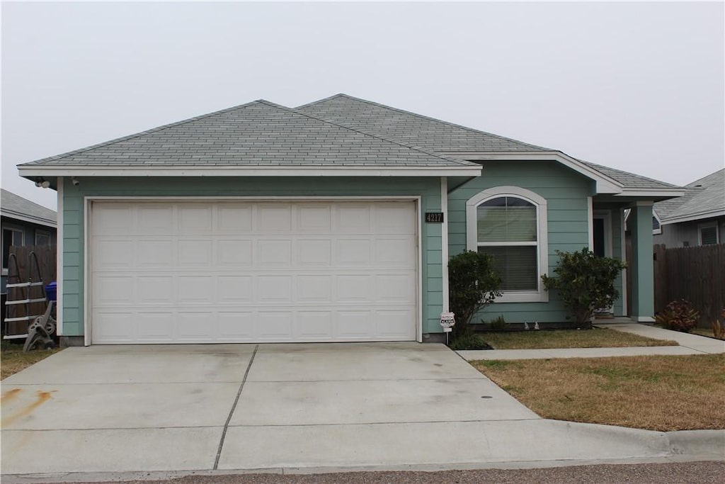 ranch-style house featuring a garage