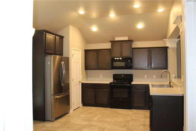 kitchen with sink, light tile patterned floors, dark brown cabinets, black appliances, and vaulted ceiling