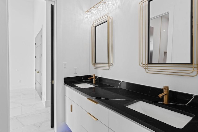 5402 Bonanza Dr, Corpus Christi, TX 78414 - bathroom featuring marble finish floors, double vanity, and baseboards