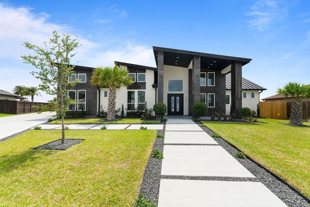 5402 Bonanza Dr, Corpus Christi, TX 78414 - modern home featuring french doors and stucco siding